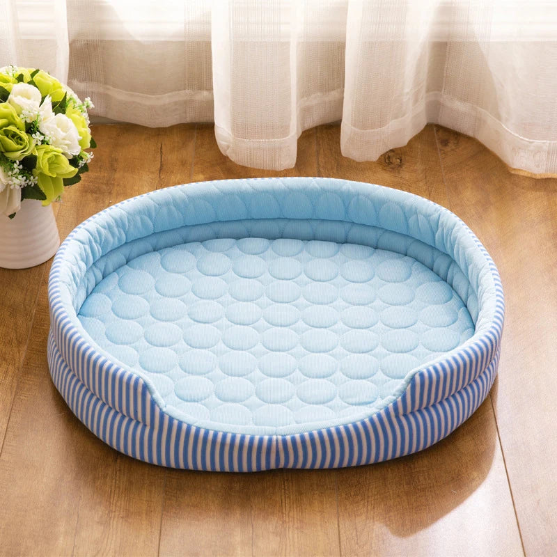 Blue cooling pet bed with striped pattern on a wooden floor