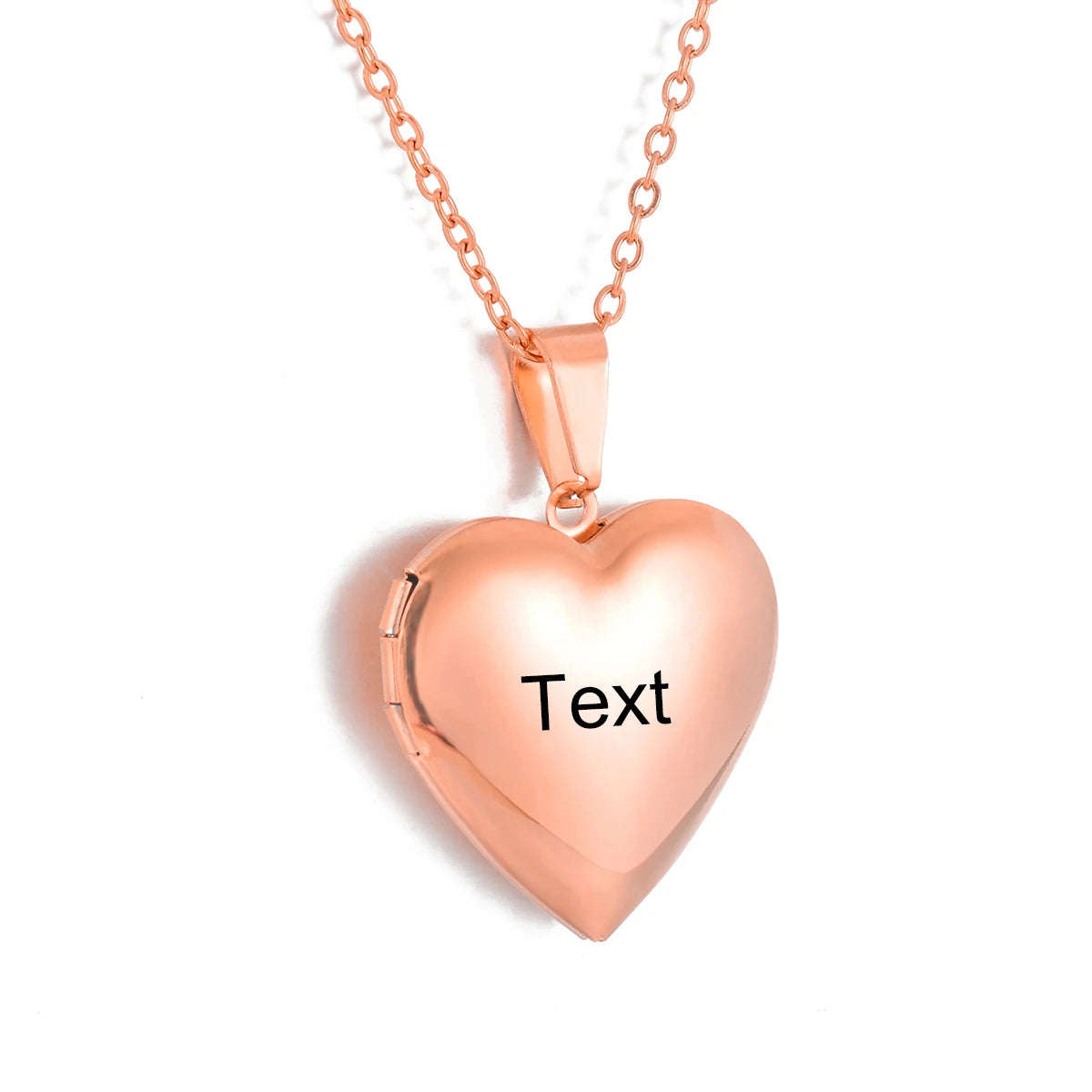 Rose gold heart-shaped locket with 'Text' engraving on a white background