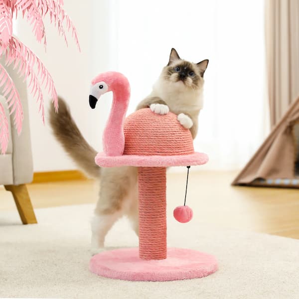 Cat playing with a pink flamingo-shaped cat toy on a carpeted floor.