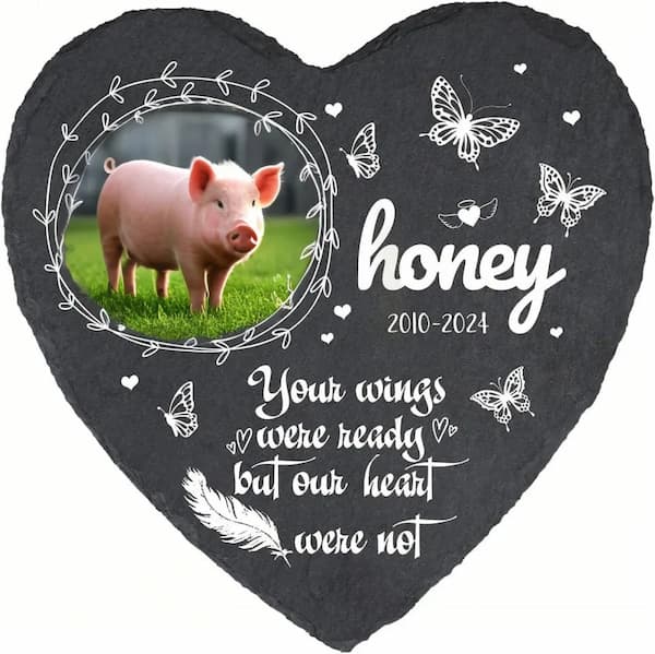 Custom pet memorial plaque with pig photo and butterfly decorations on heart-shaped slate for garden memorial