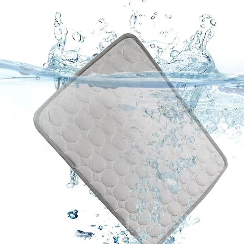 Cooling Pet Ice Mat – Lightweight summer bed for cats and small dogs in blue and grey. Soft, breathable material. Available in two sizes.