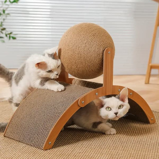 Two cats playing with a cat scratcher on a wooden floor.