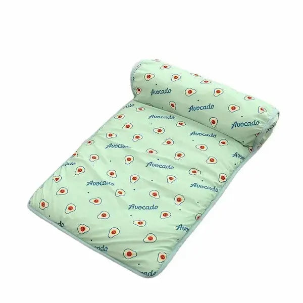 Breathable Summer Cooling Dog & Cat Mat shown on sofa. Lightweight, washable pet blanket designed to keep dogs and cats cool during hot weather.