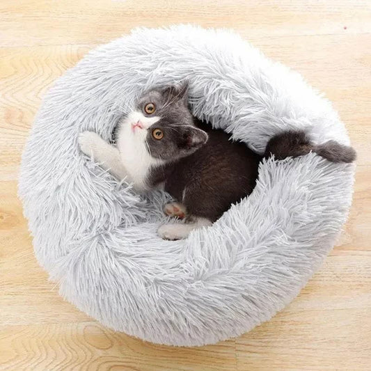 Soft and cozy cat bed with long plush fabric, perfect for small pets