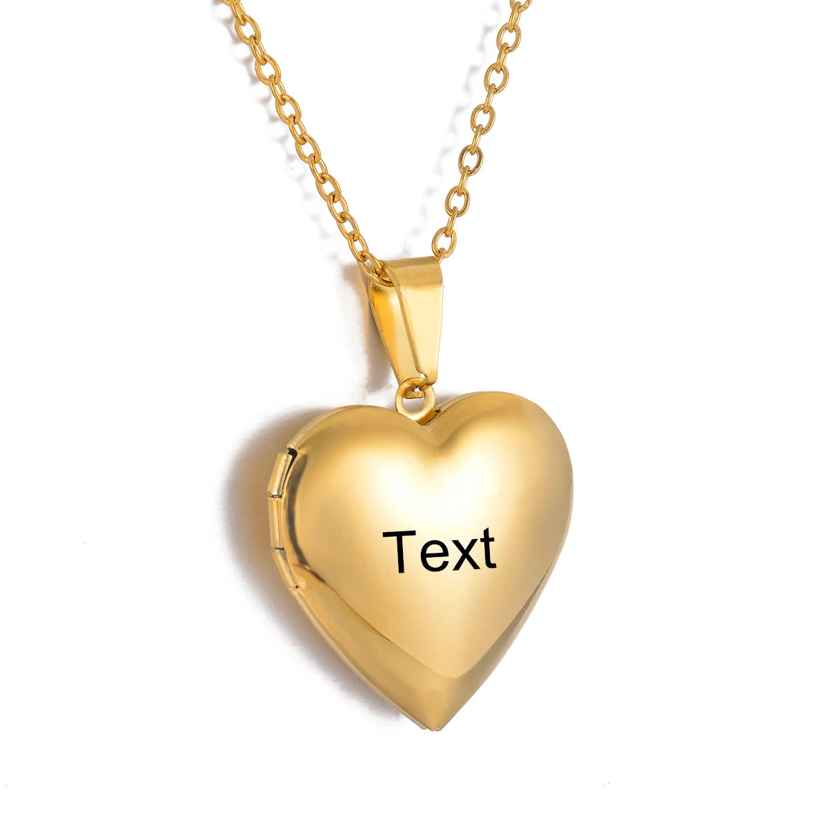 Gold heart-shaped locket with 'Text' engraving on a white background