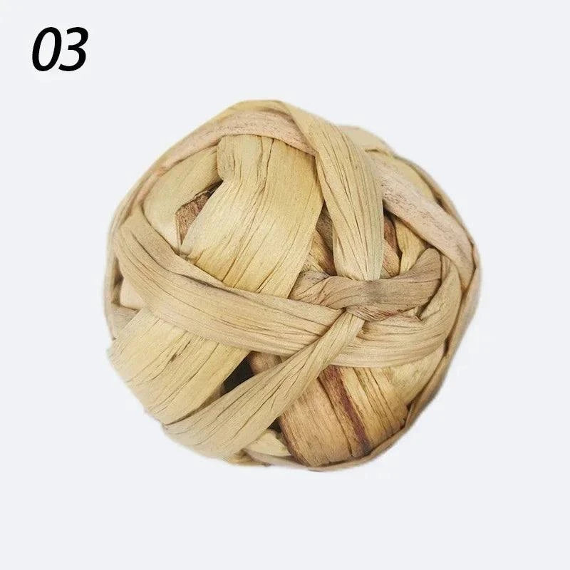Braided natural grass chew ball for small pets, 7cm toy for guinea pigs, rabbits, and hamsters.