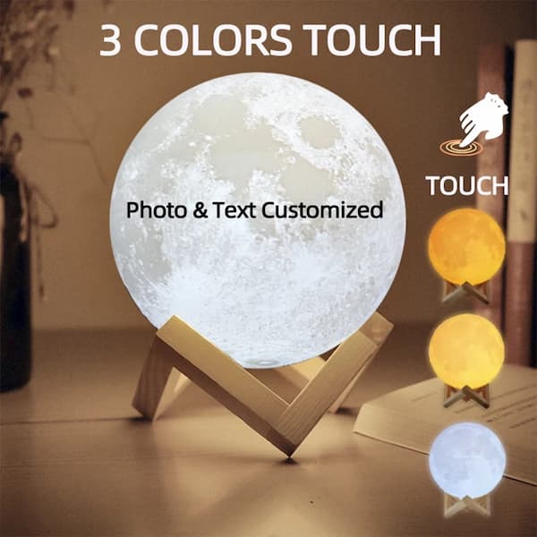 Moon-shaped lamp with customizable colors on a wooden stand