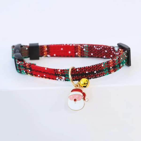 Red and green plaid pet collar with a Santa hat charm on a white background