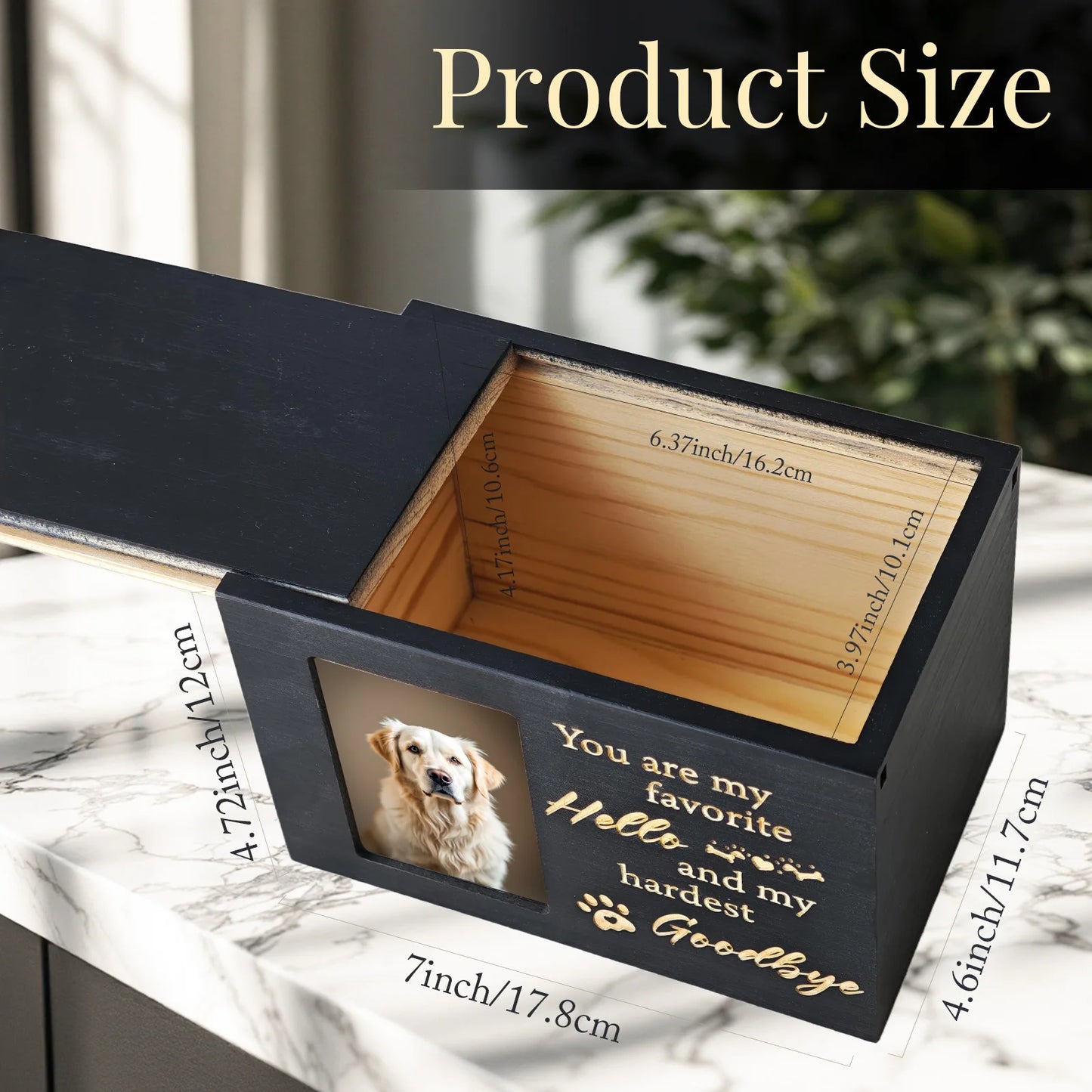 Black wooden box with a photo of a dog and engraved text on a marble surface.
