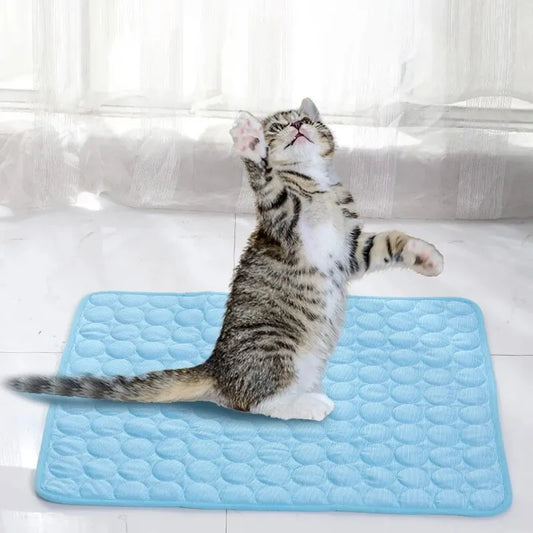 Cooling Pet Ice Mat – Lightweight summer bed for cats and small dogs in blue and grey. Soft, breathable material. Available in two sizes.