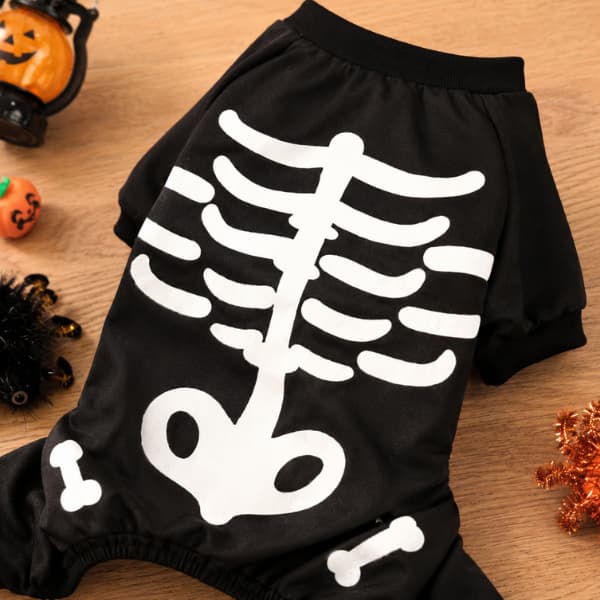 Close-up of black skeleton dog Halloween jumpsuit with white bone print