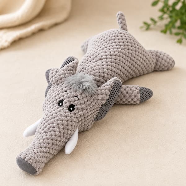 Soft crochet-style elephant plush dog toy designed for puppies and dogs for interactive play and comfort