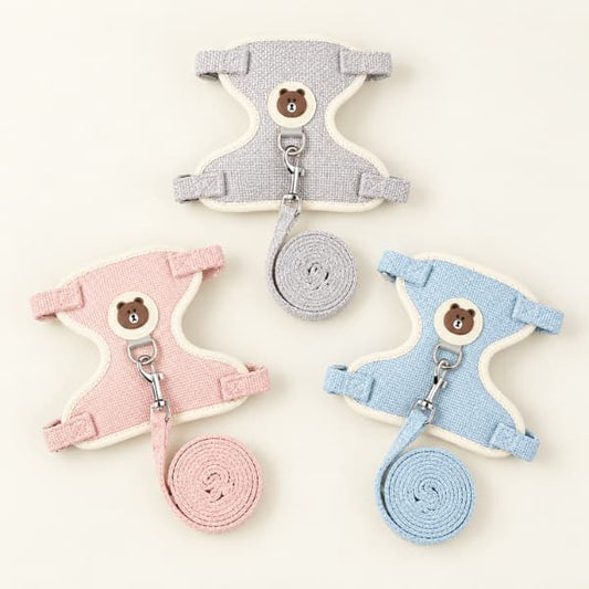 Pink, grey and blue adjustable cat harnesses displayed with their matching leashes.