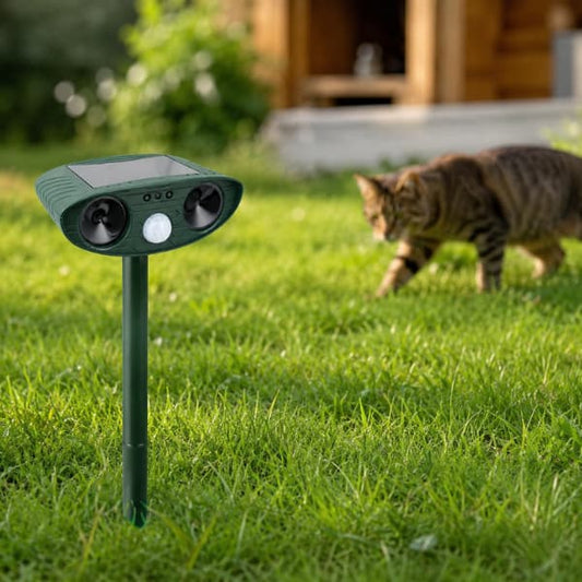Solar powered ultrasonic animal repeller in a garden lawn helping deter cats and unwanted animals near outdoor spaces and chicken coop areas.