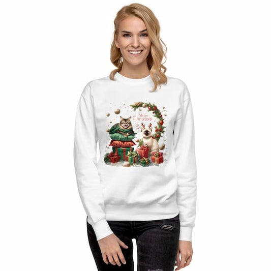 Woman wearing a white sweatshirt with a Christmas-themed design featuring two cats.