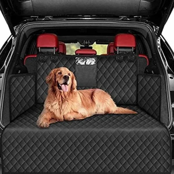 dog relaxing on rear seat car hammock