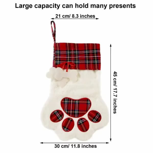 Dog paw-shaped Christmas stocking with plaid pattern and measurements on a white background