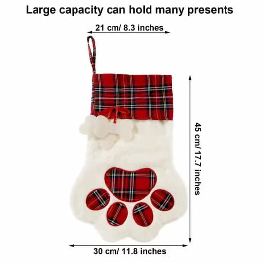 Dog paw-shaped Christmas stocking with plaid pattern and measurements on a white background