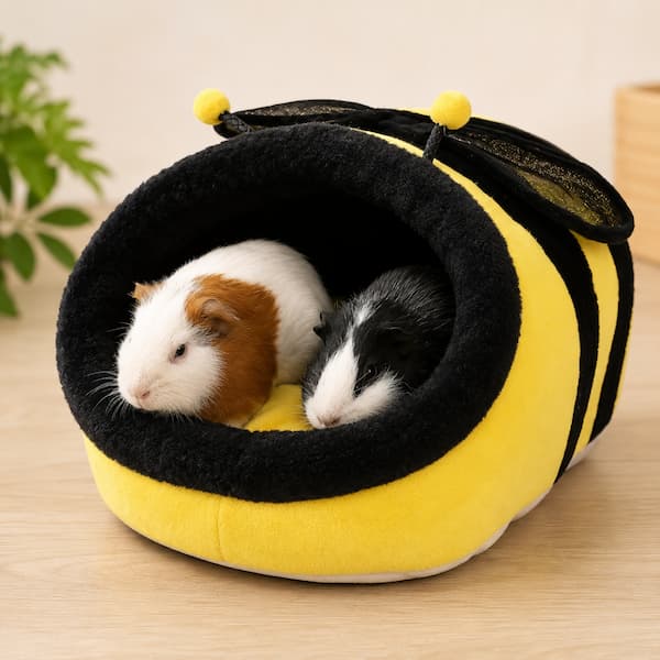 Guinea pigs resting inside soft plush bee shaped pet bed providing warm and cozy small animal shelter