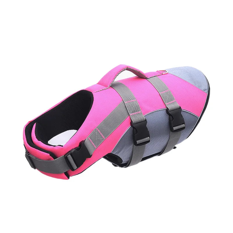 Pink and gray dog life jacket on a white background