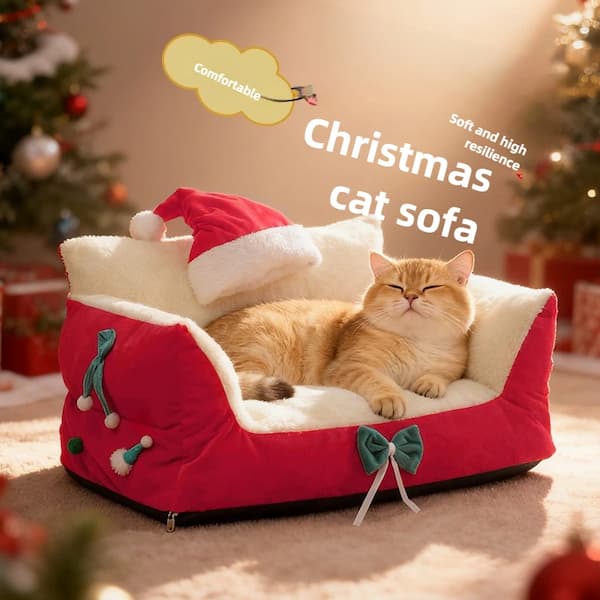 Cat lying on a red Christmas-themed cat sofa with festive decorations.
