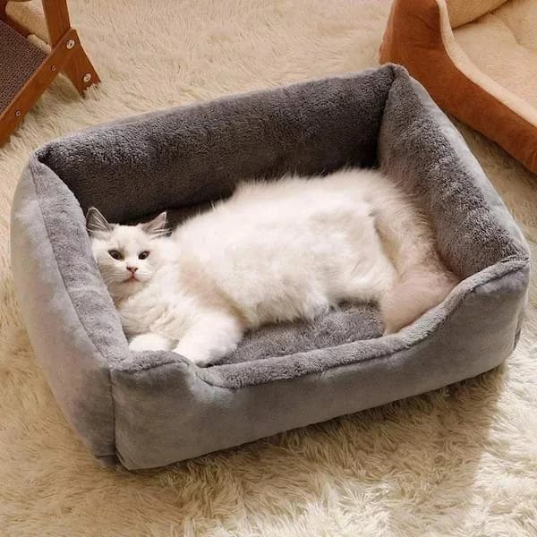 Rectangular plush pet bed with raised edges
