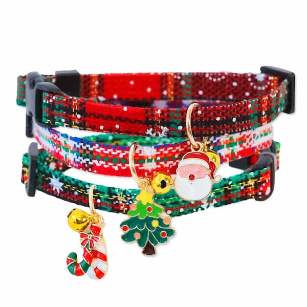 Colorful Christmas-themed cat collar with Santa Claus and tree charms on a white background