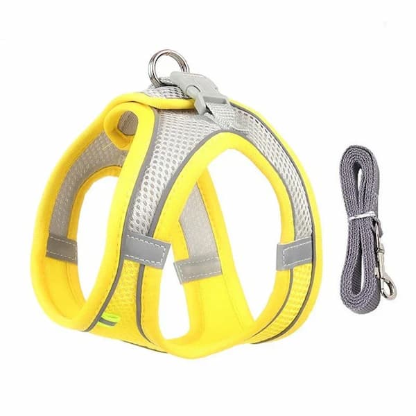 Yellow dog harness with reflective stripes and a leash on a white background
