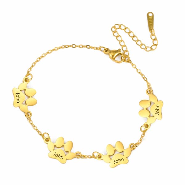 Gold bracelet with paw-shaped charms on a white background