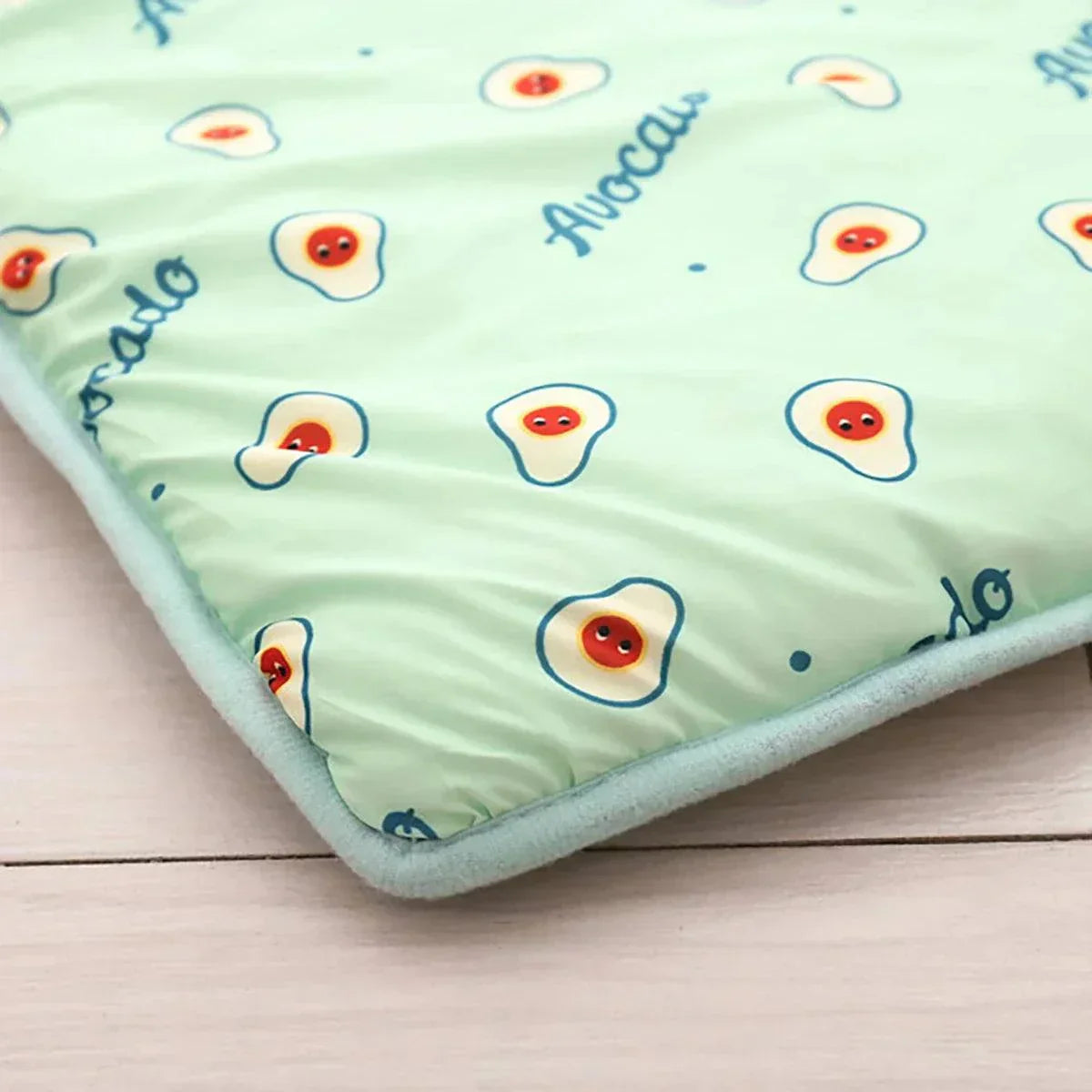 Dog cooling summer pad bed with avocado print design, washable.