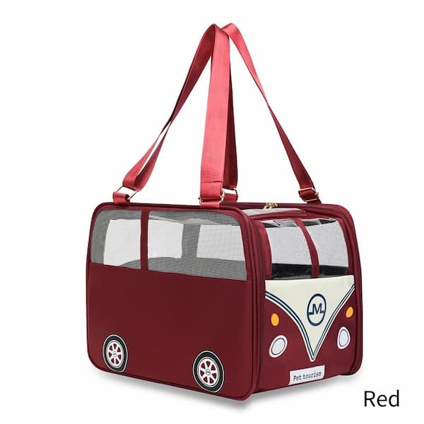 A red pet carrier bag designed to look like a retro VW bus, featuring clear mesh windows, two red shoulder straps, and a cream-colored front panel with cartoon-style headlights and a circular 'M' logo.