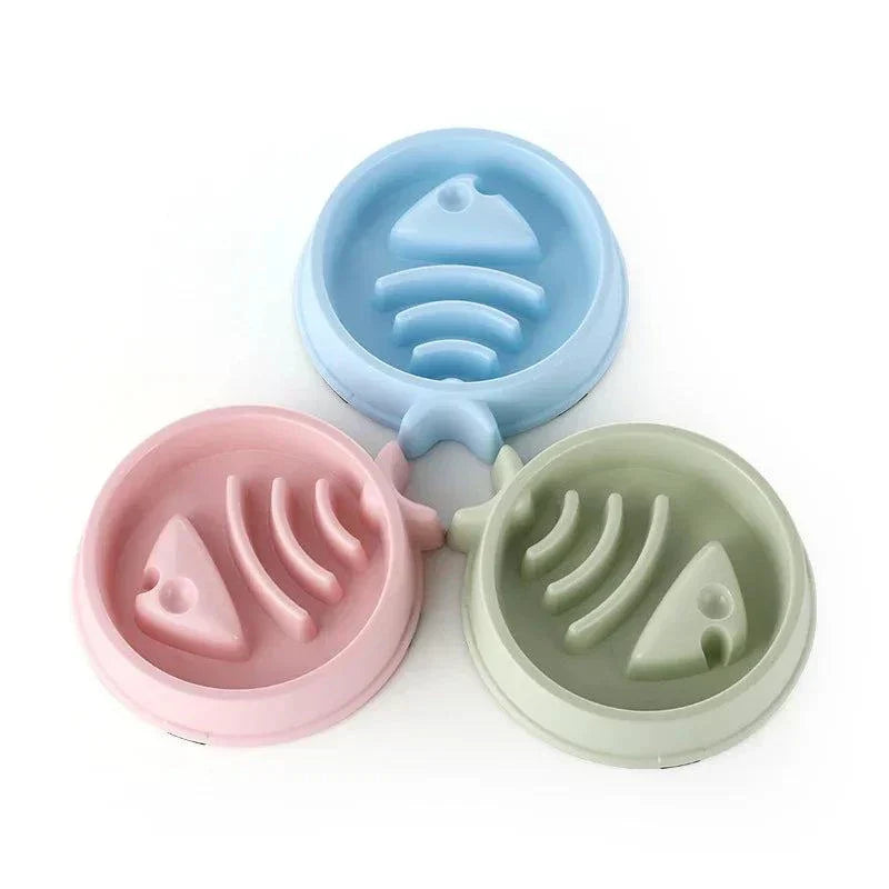 Anti-choking slow feeding bowl for cats and dogs in pink, blue, and green, designed to promote healthy eating.