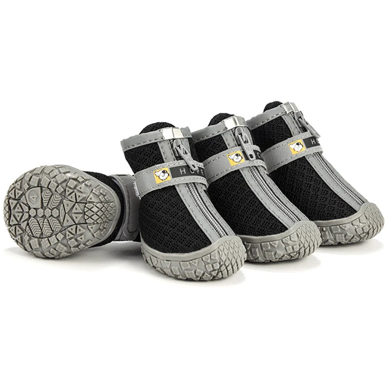 Pair of black and gray dog boots on a white background