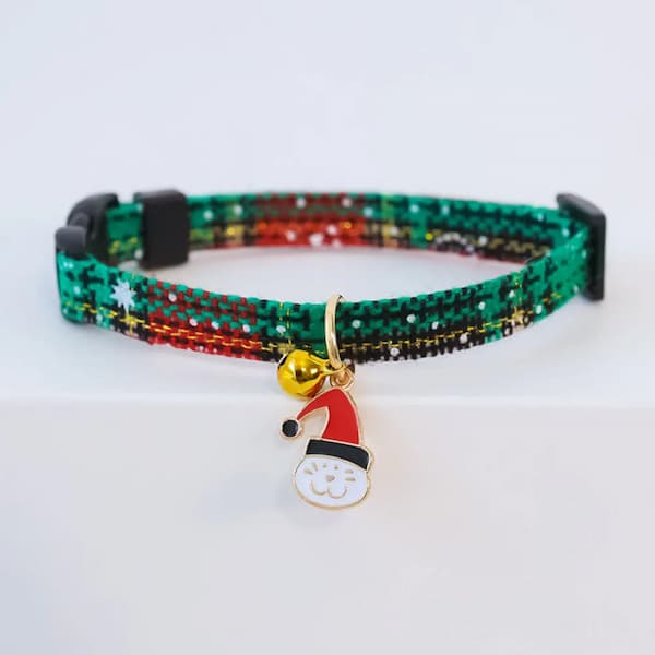 Colorful beaded cat collar with a Santa hat charm on a white background