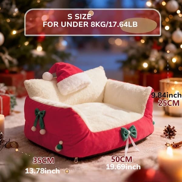 Red pet bed with white cushion, Santa hat, and green bows on a festive background.