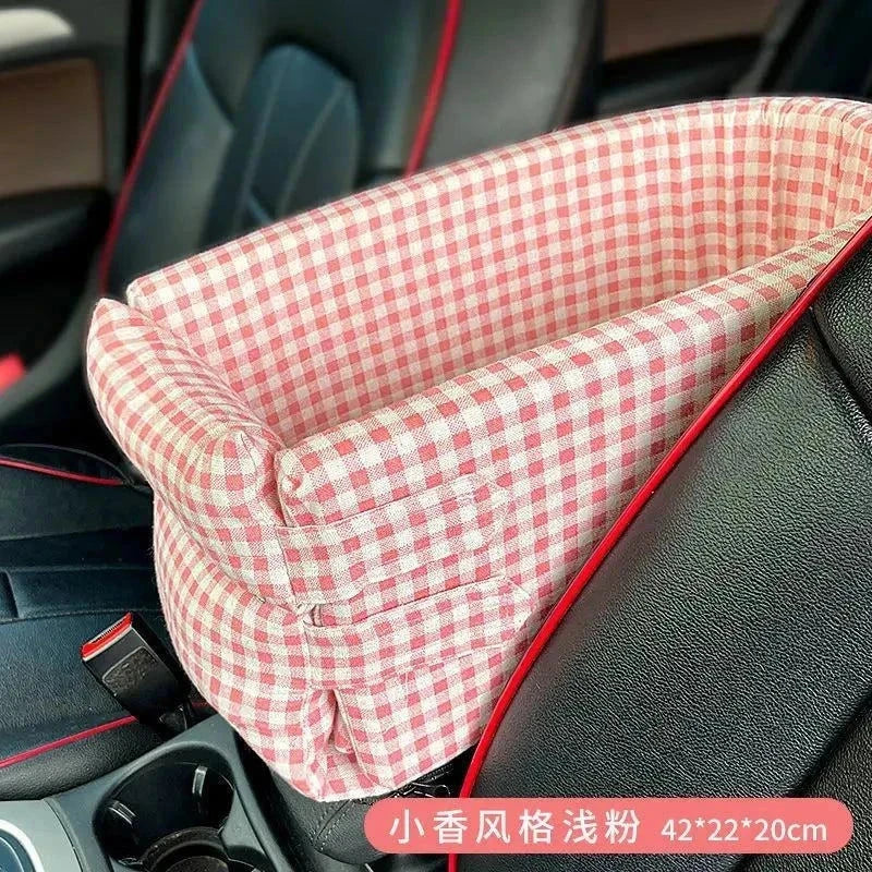 Portable dog and cat car seat bed with cushioned comfort and safety straps, pink checkered design.