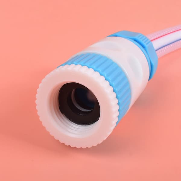 Close-up of a hose nozzle with blue and white design on a pink background