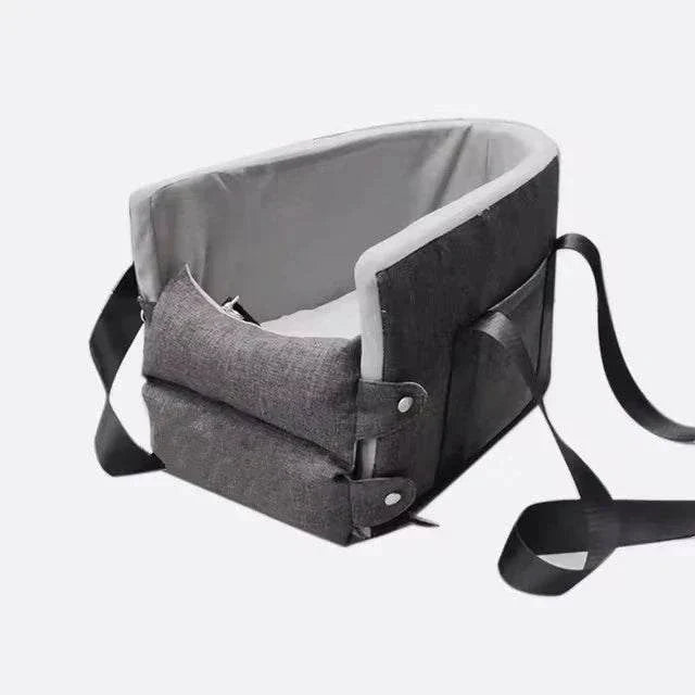 Portable grey dog car seat bed with adjustable straps for small pets, providing safety and comfort during travel.