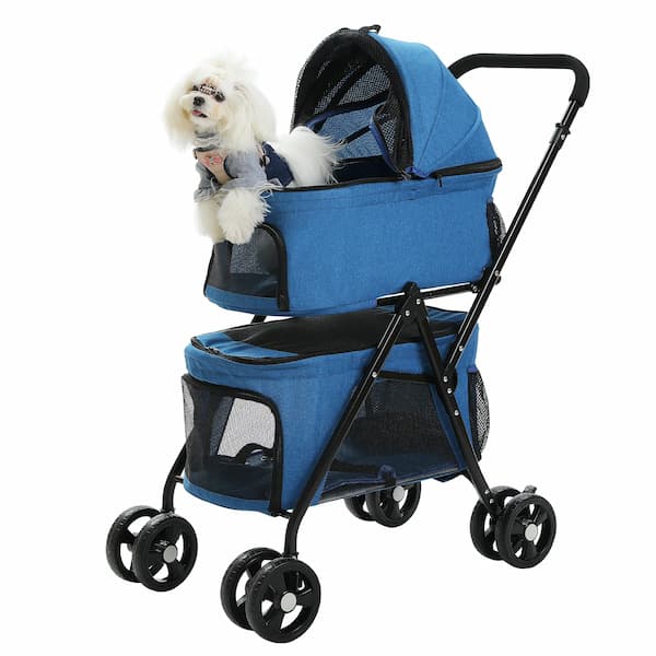 Blue pet stroller with a small white dog inside on a white background
