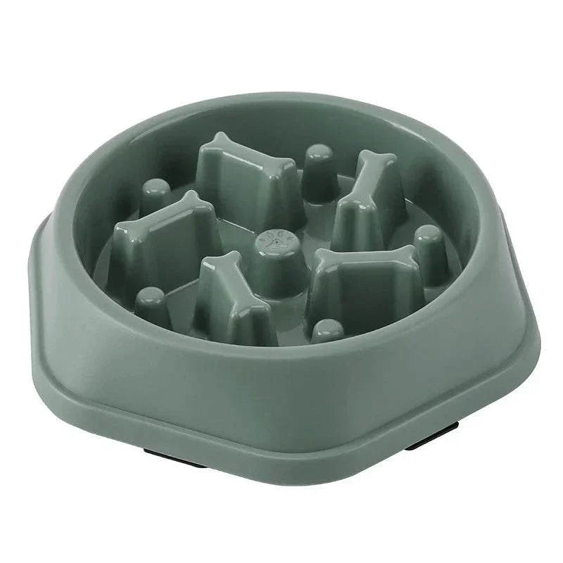 Anti-choking slow feeding bowl for dogs and cats, green with inner design to promote healthy eating and prevent rapid consumption.