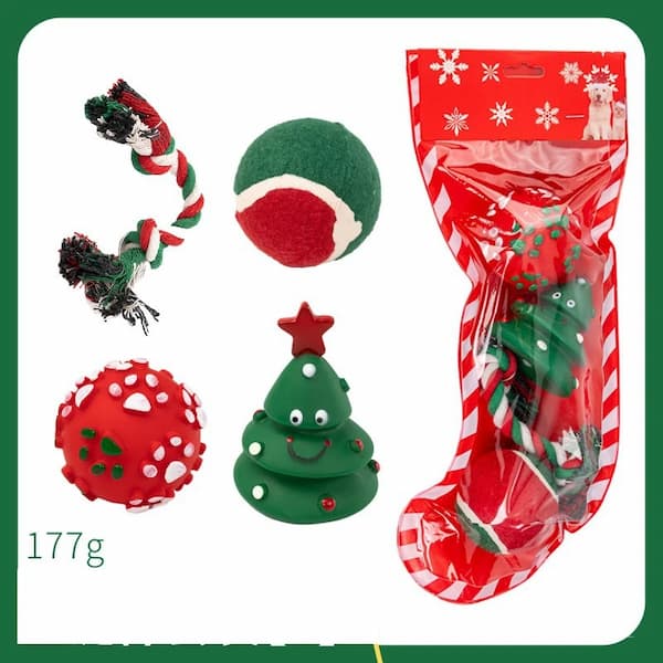 Collection of Christmas-themed dog toys including a stocking, tree, and balls on a white background.