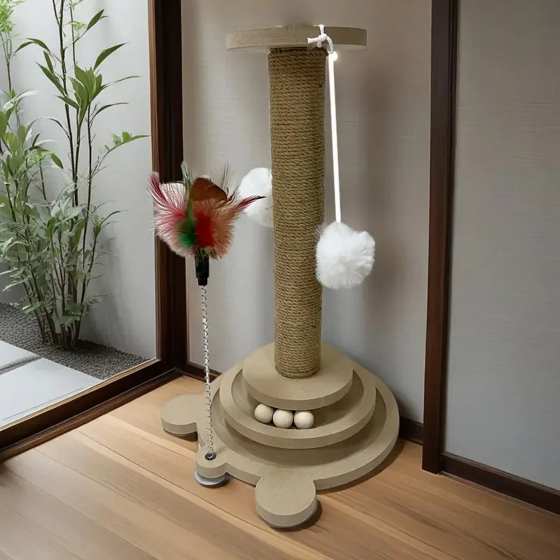 Cat play tower with scratching post, feathers, and balls on a wooden floor.