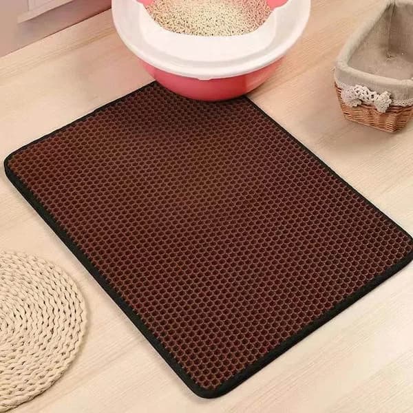 Brown honeycomb mat on a light wooden floor with pet accessories in the background