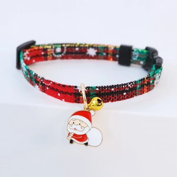 Bracelet with Santa Claus charm and bell on a white background