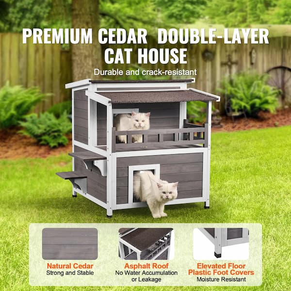 Premium cedar double-layer cat house with cats inside, set against a green outdoor background.
