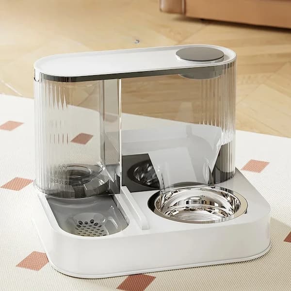 Pet feeding and water station with transparent top on a wooden floor.