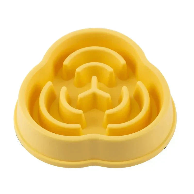 Yellow anti-choking slow feeding bowl for pets, designed to promote healthy eating and prevent digestive issues.