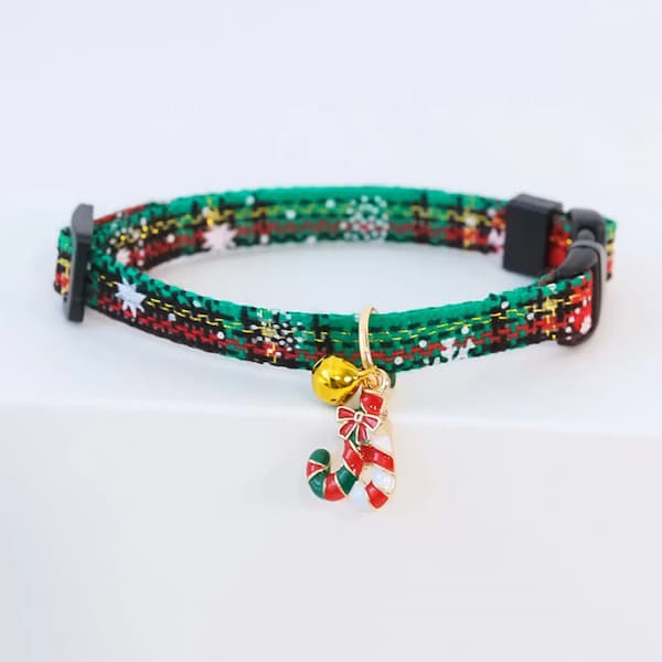 Christmas-themed cat collar with candy cane charm on a white background