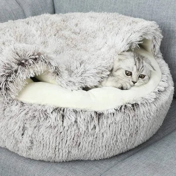 Cat resting inside a soft plush 2-in-1 cozy pet bed designed for warmth and comfort for cats and small dogs.