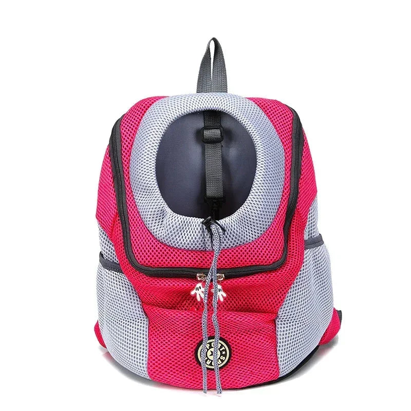 Pink and gray pet carrier backpack on a white background